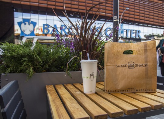 Flatbush Avenue Shake Shack Outdoor Seating - table with drink cup and Shake Shack bag