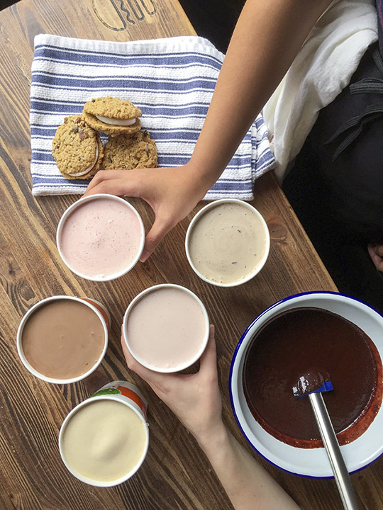 Shake Shack shakes, cookies and towel on a Shack wooden table