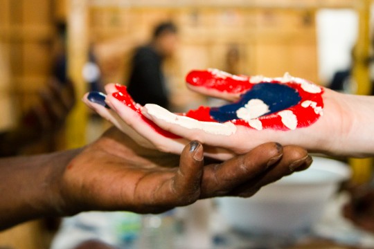 Red, white and blue painted hand at Refoundry