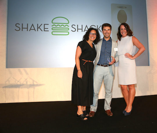 Shake Shack employees holding award and posing for a picture