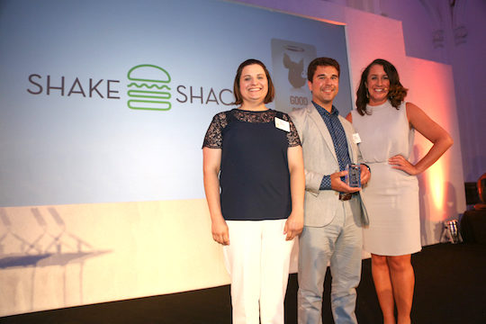 Shake Shack employees holding award