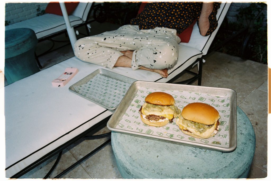 Two Nacho Burgers on trays