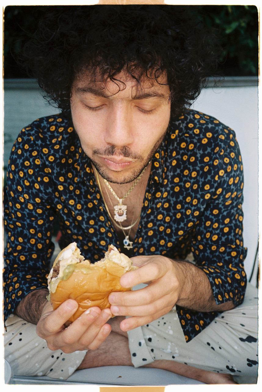 Benny eating a burger