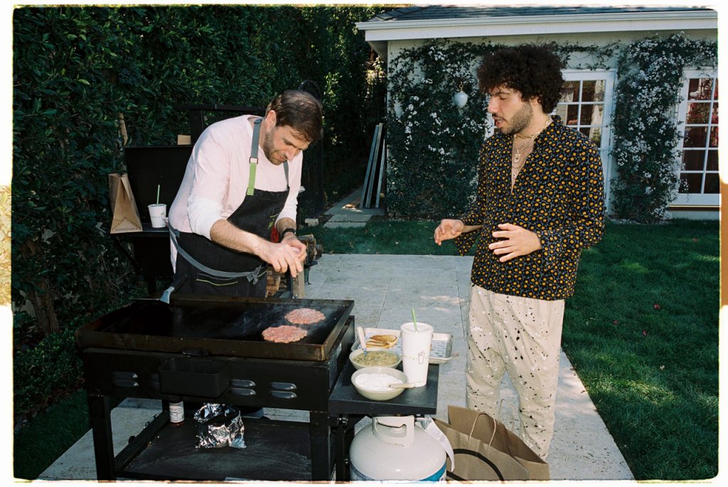 Mark Rosati and Benny Blanco grilling burger patties
