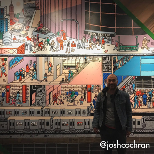 Mural at Penn Station with person standing in front