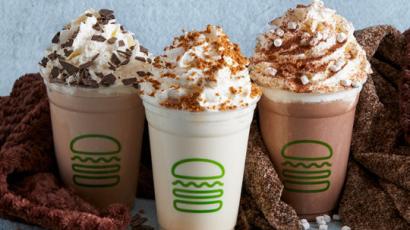 three shakes sitting with different toppings