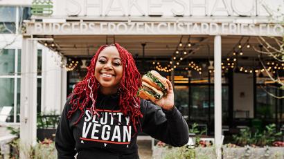 Pinky Cole holding a burger