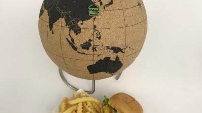 Globe, burger, and fries on a table