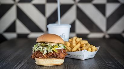 burger, fries and drink sitting on a table