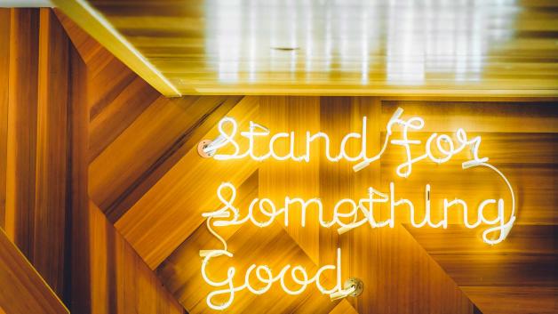 Neon sign that says Stand for Something Good